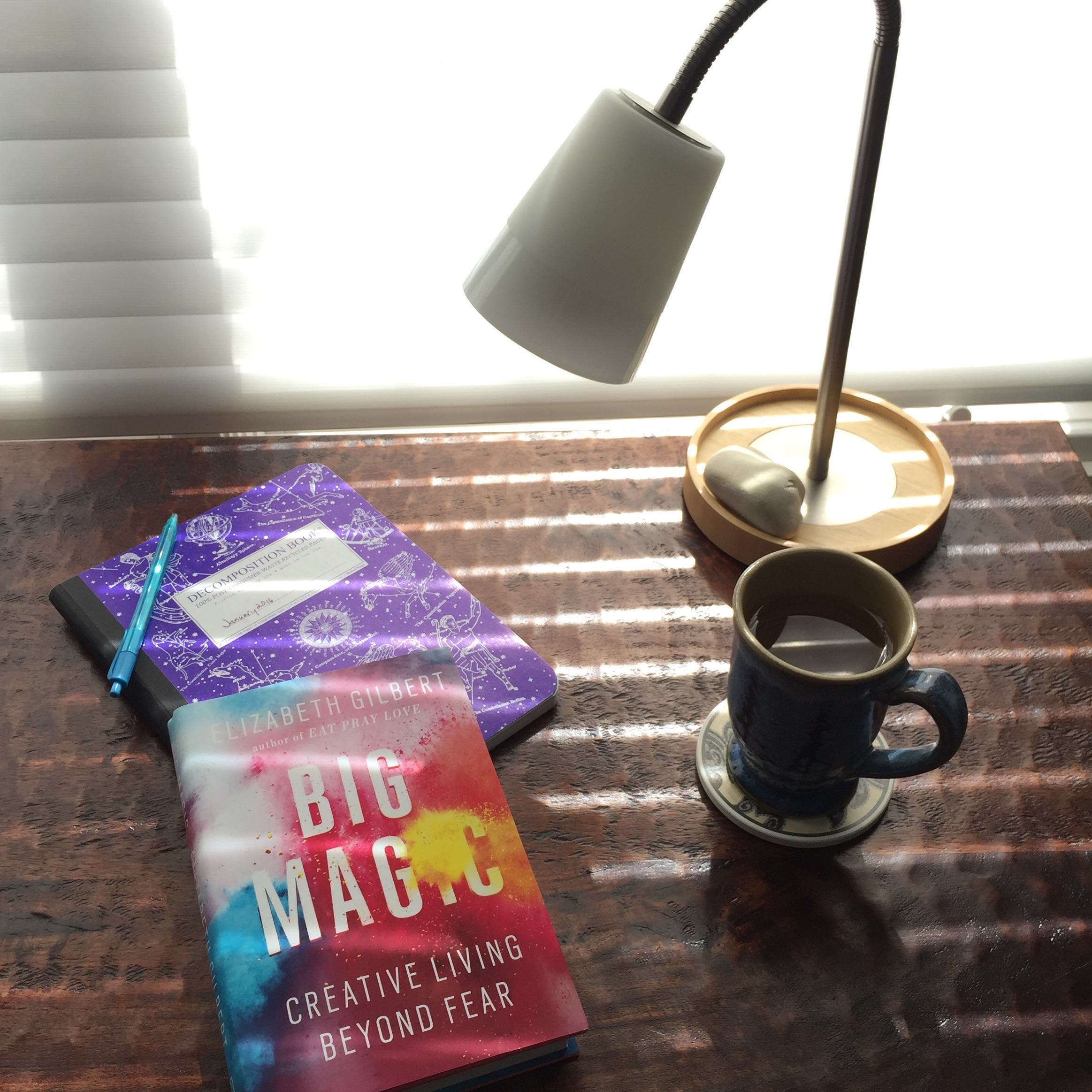 Big Magic by Elizabeth Gilbert on my desk. The book cover is wonderfully colorful. I have all the other books I mentioned in this article as ebooks.