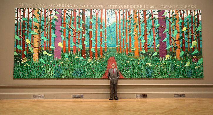 Hockney poses before Arrival of Spring in Woldgate, 2011. Source