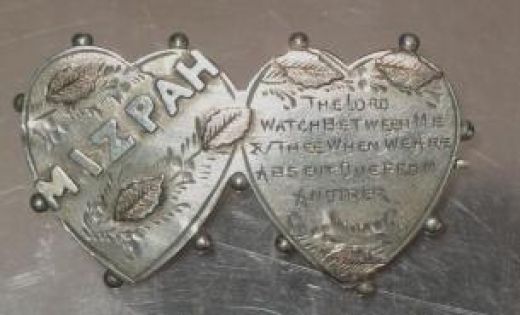 Typical Mizpah brooch.
