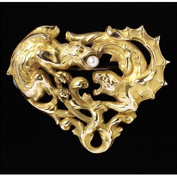 Brooch, stamped rolled gold (copper alloy) with pearl V&A Museum