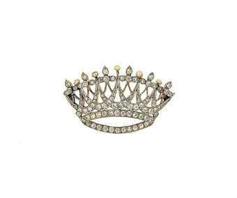 A Belle Epoque diamond brooch Modelled as a brilliant-cut diamond pierced openwork coronet of stylised swag design with diamond trefoil and seed pearl alternate terminals, mounted in platinum and gold, circa 1900. Christie’s Sale 8474