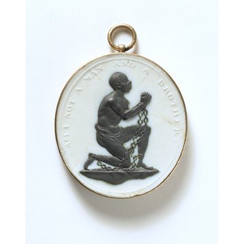 England, c. 1787 White Jasper with a black relief and mounted in gilt-metal Medallion worn by advocates for the abolition of slavery. V&A Museum