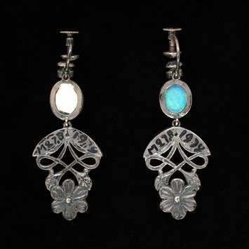 London, 1934 Earrings with silver, opals, rubies and stained chalcedony Showing screw back for non-pierced ears V&A Museum