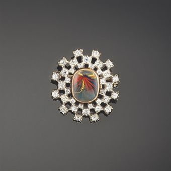 An early 19th century diamond locket brooch Of old brilliant-cut diamond starburst design, the central locket compartment enclosing a later fishing fly, circa 1820Christie’s Sale 5642