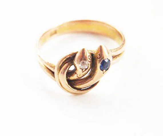  Mid to late Victorian gold duel serpent ring set with diamond and sapphire