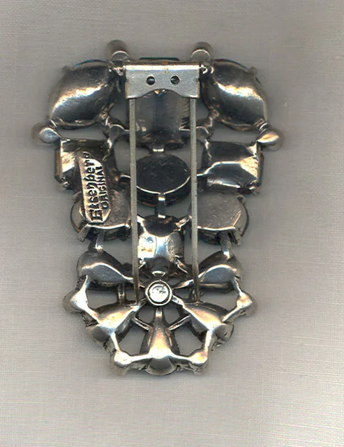 Back of an 'Eisenberg Original' brooch with a double hinged clip or 'fur clip'. 