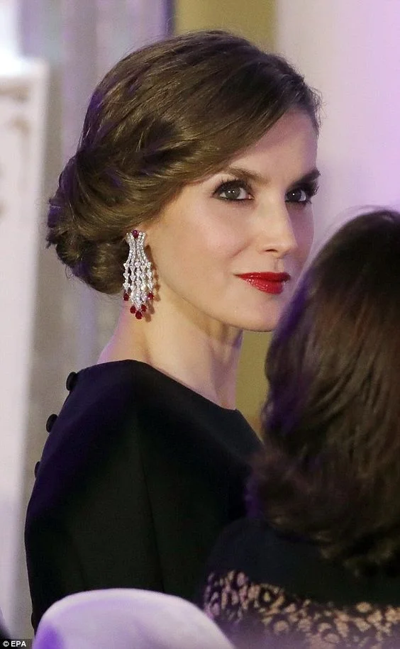 Queen Letizia of Spain wearing chandelier style earrings.