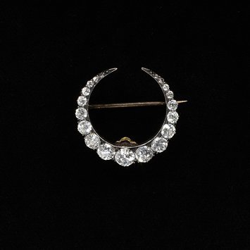 The simple crescent moon was a popular motif in the late Victorian era England, c. 1890 Gold set with diamonds V&A Museum