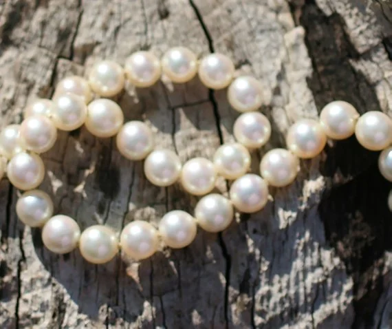 A flawless, stunning and very fine vintage Princess length Mikimoto Akoya Saltwater Pearl Necklace with 14 karat white gold clasp.