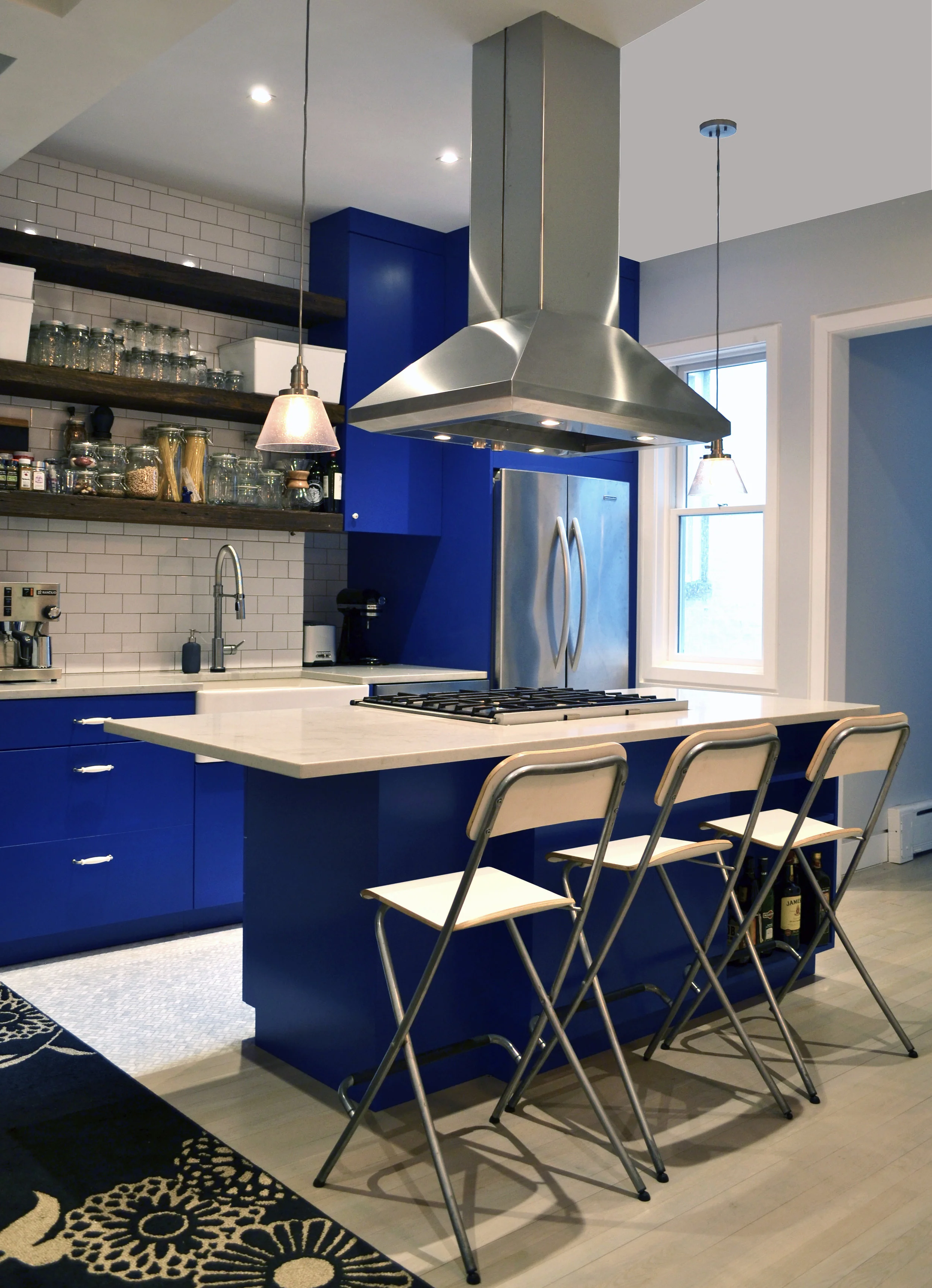 Modern kitchen with bright blue cabinets