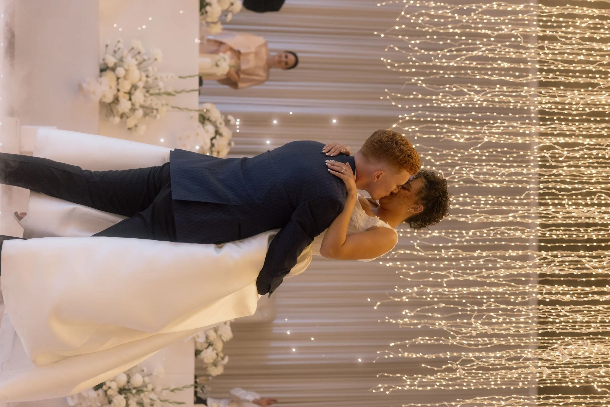 wedding-couple-kissing-at-reception-photographer.jpg