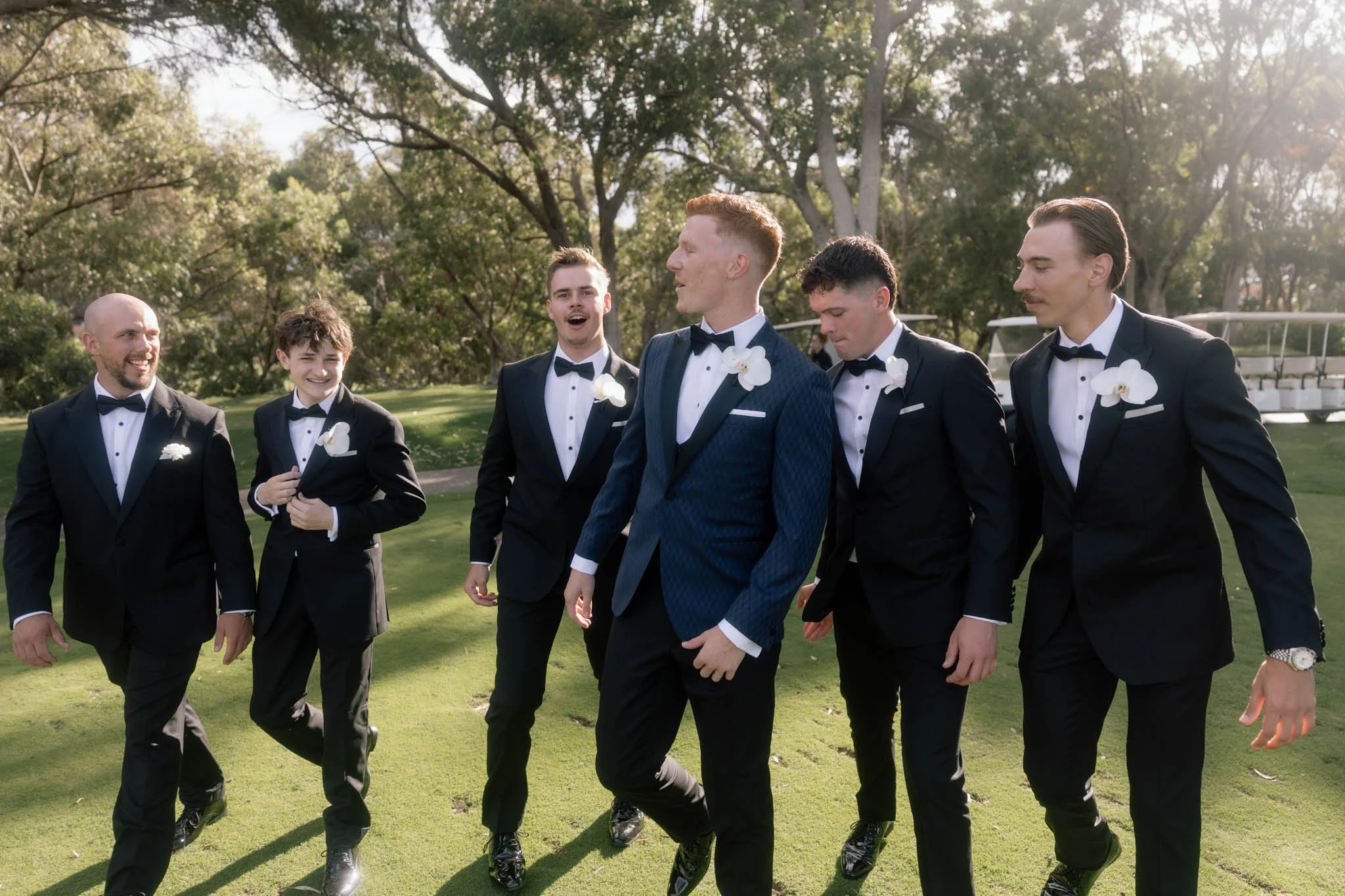 groomsmen-walking-golf-course-wedding-photographer.jpg