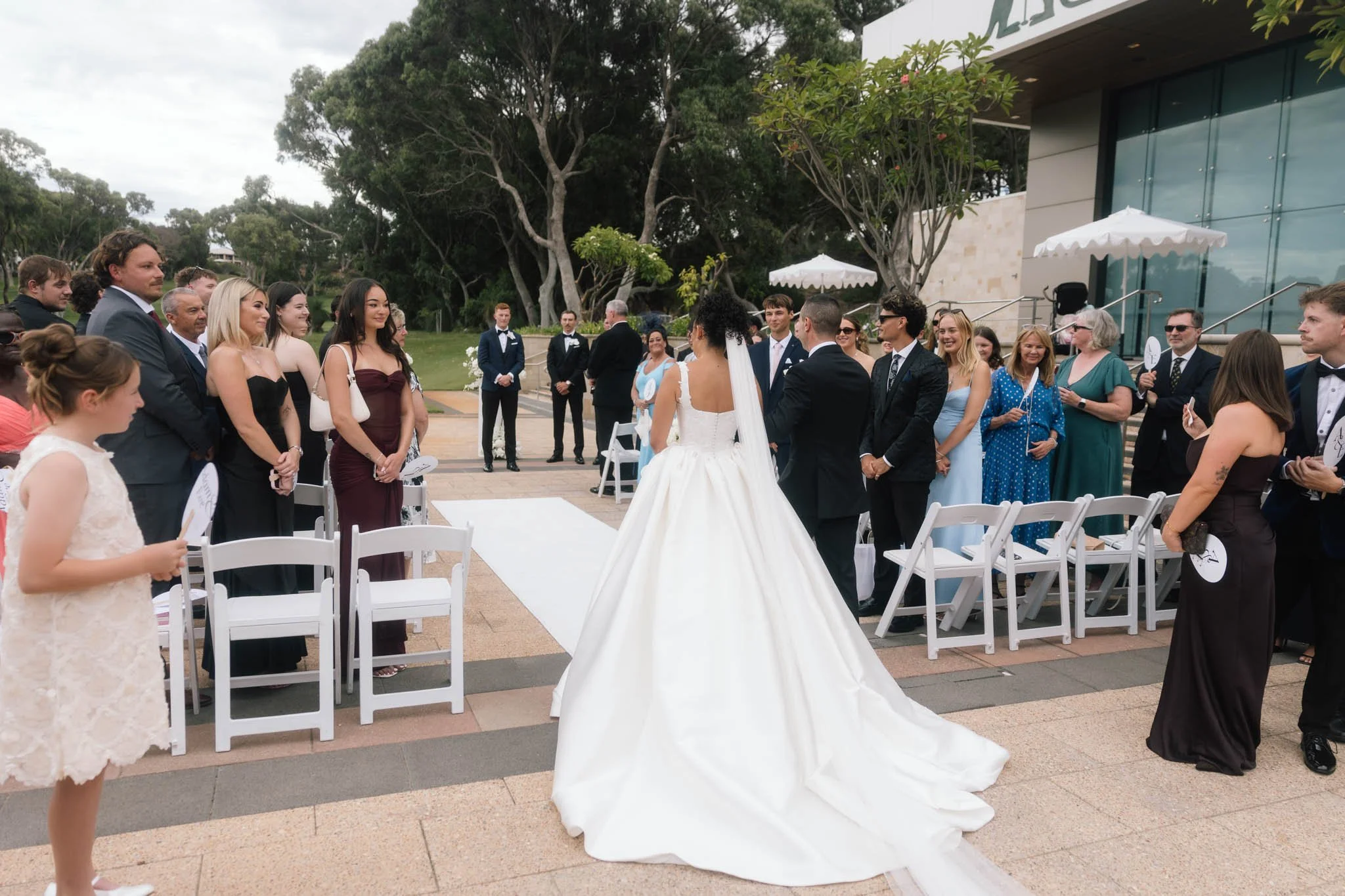 bride-walking-down-aisle-wedding-photographer-videographer.jpg