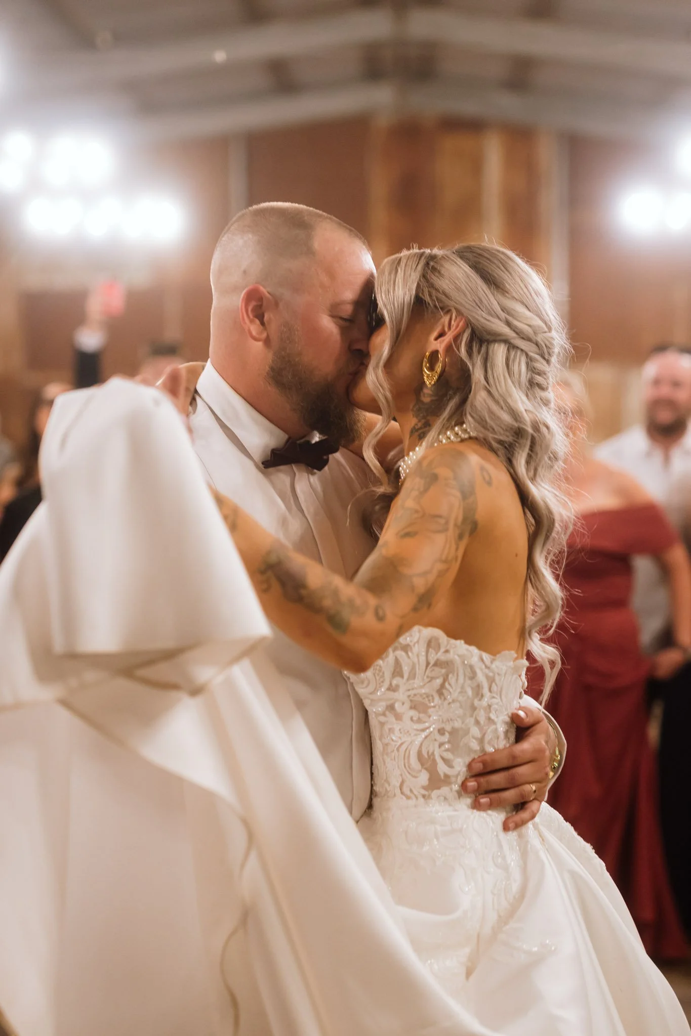 A romantic, close-up photograph of a bride and groom kissing during their first dance at a Buckland Estate wedding reception, captured by a luxury Perth wedding photographer