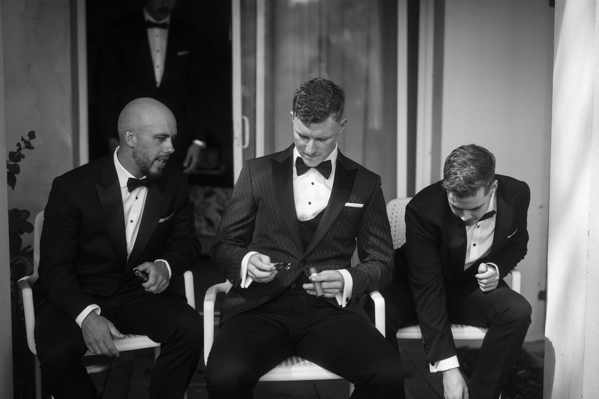groomsmen-preparing-wedding-photographer-videographer.jpg