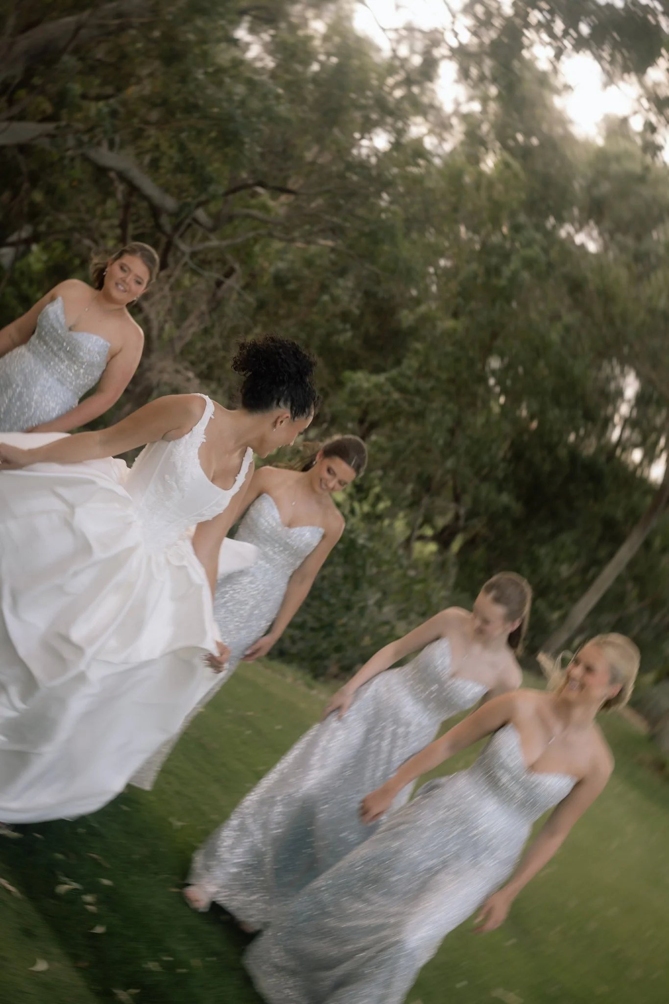 bride-and-bridesmaids-walking-wedding-photographer.jpg