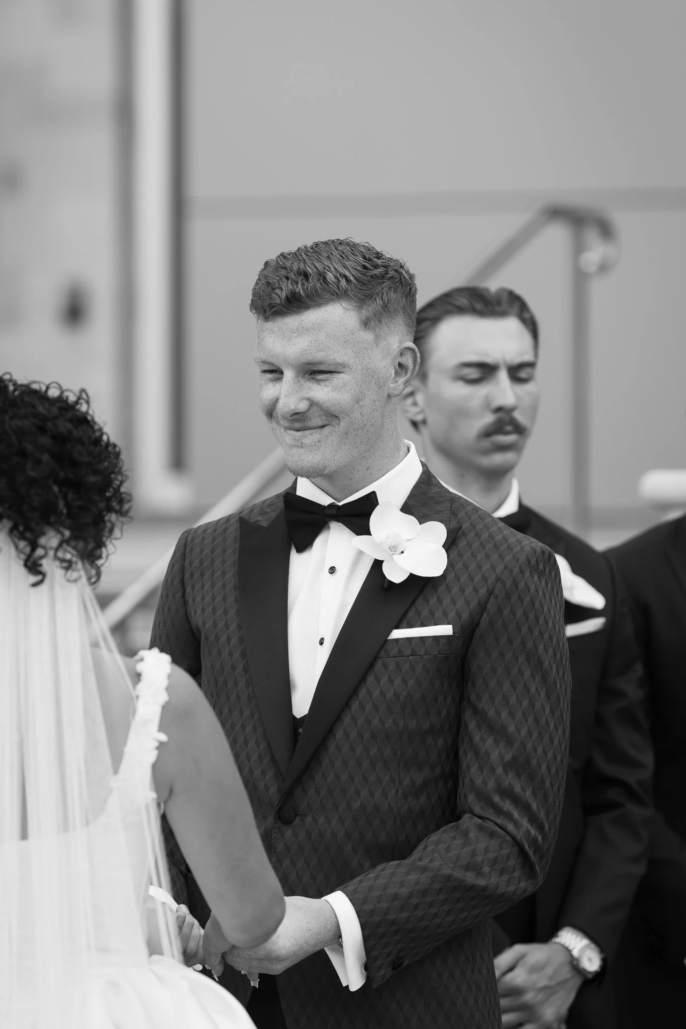 groom-smiling-at-bride-wedding-photographer.jpg