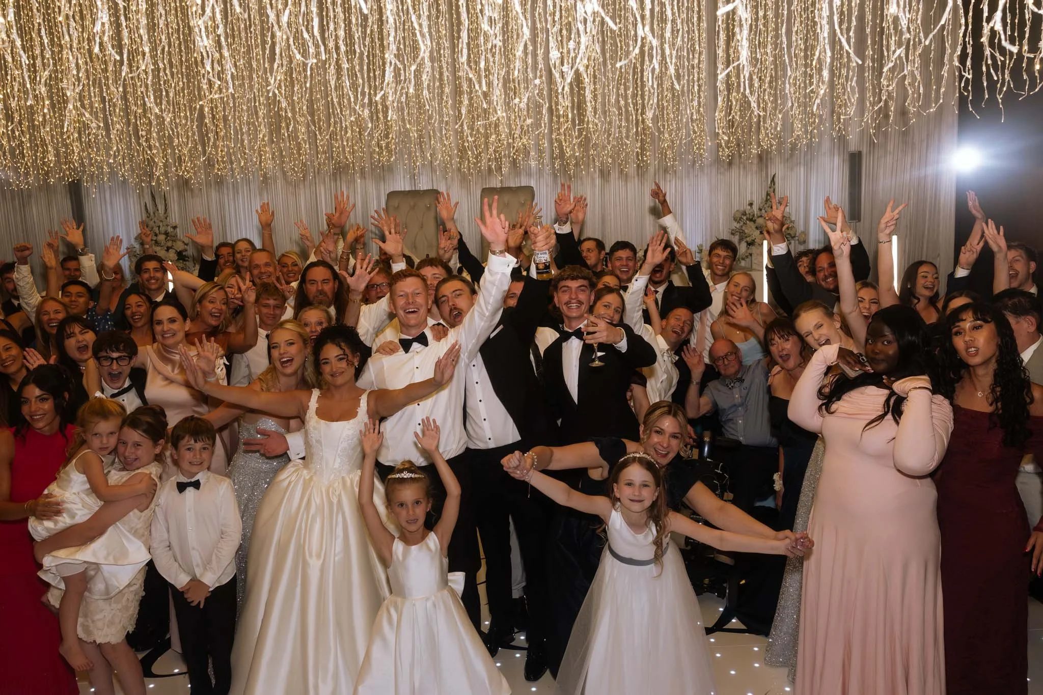 wedding-photographer-captures-guests-dance-floor-celebrate.jpg