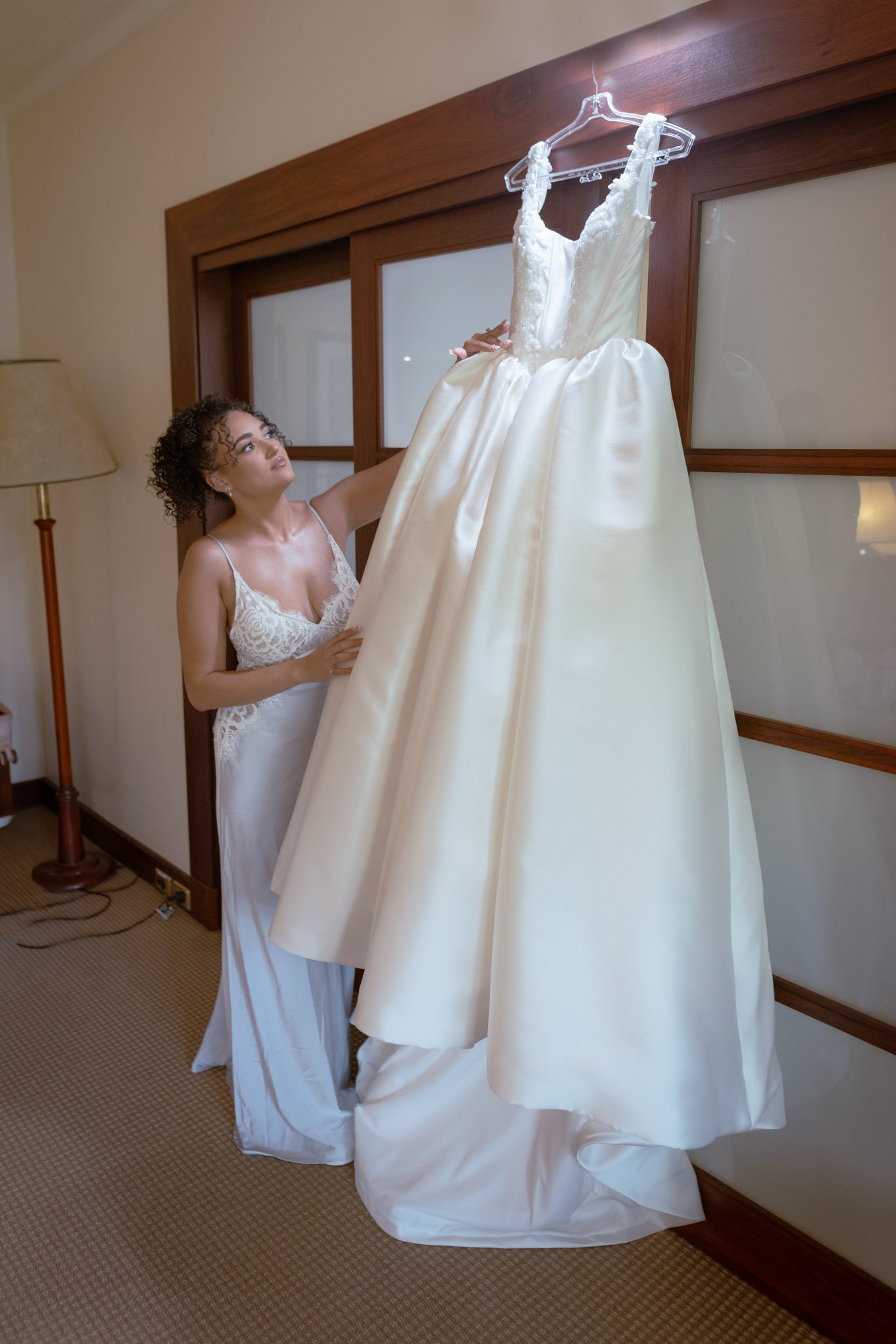 bride-adjusting-wedding-dress-wedding-photographer.jpg