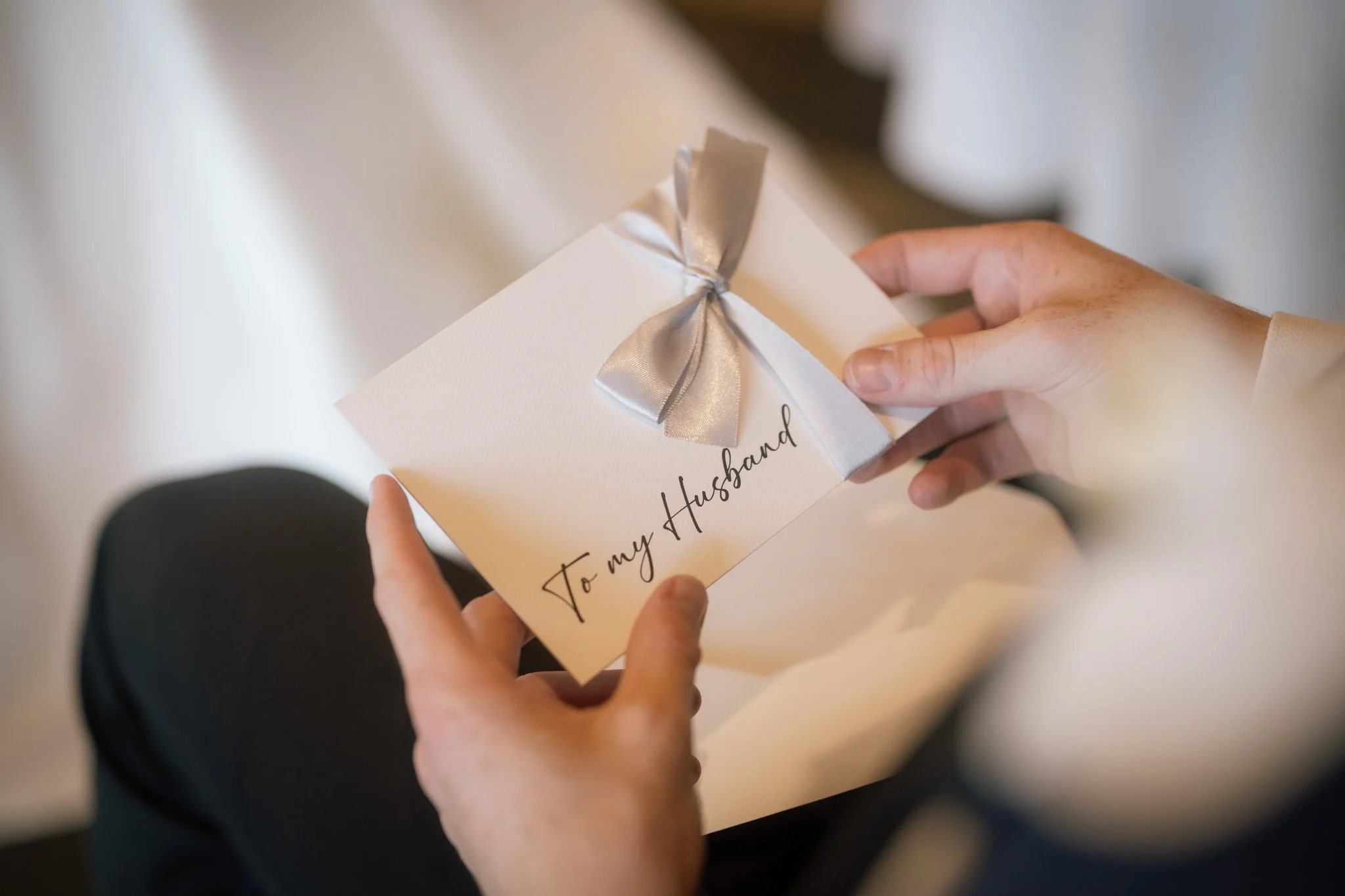 groom-holding-to-my-husband-card-wedding-photographer.jpg