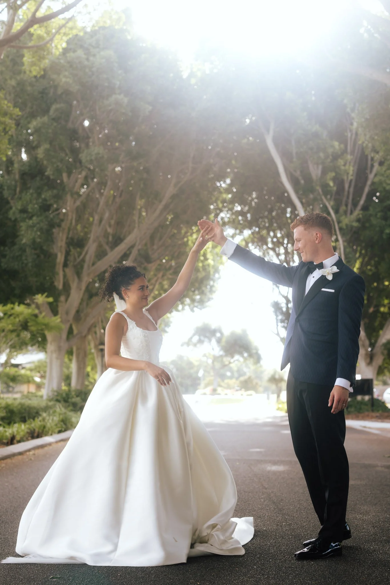 wedding-photographer-couple-dancing-under-trees.jpg