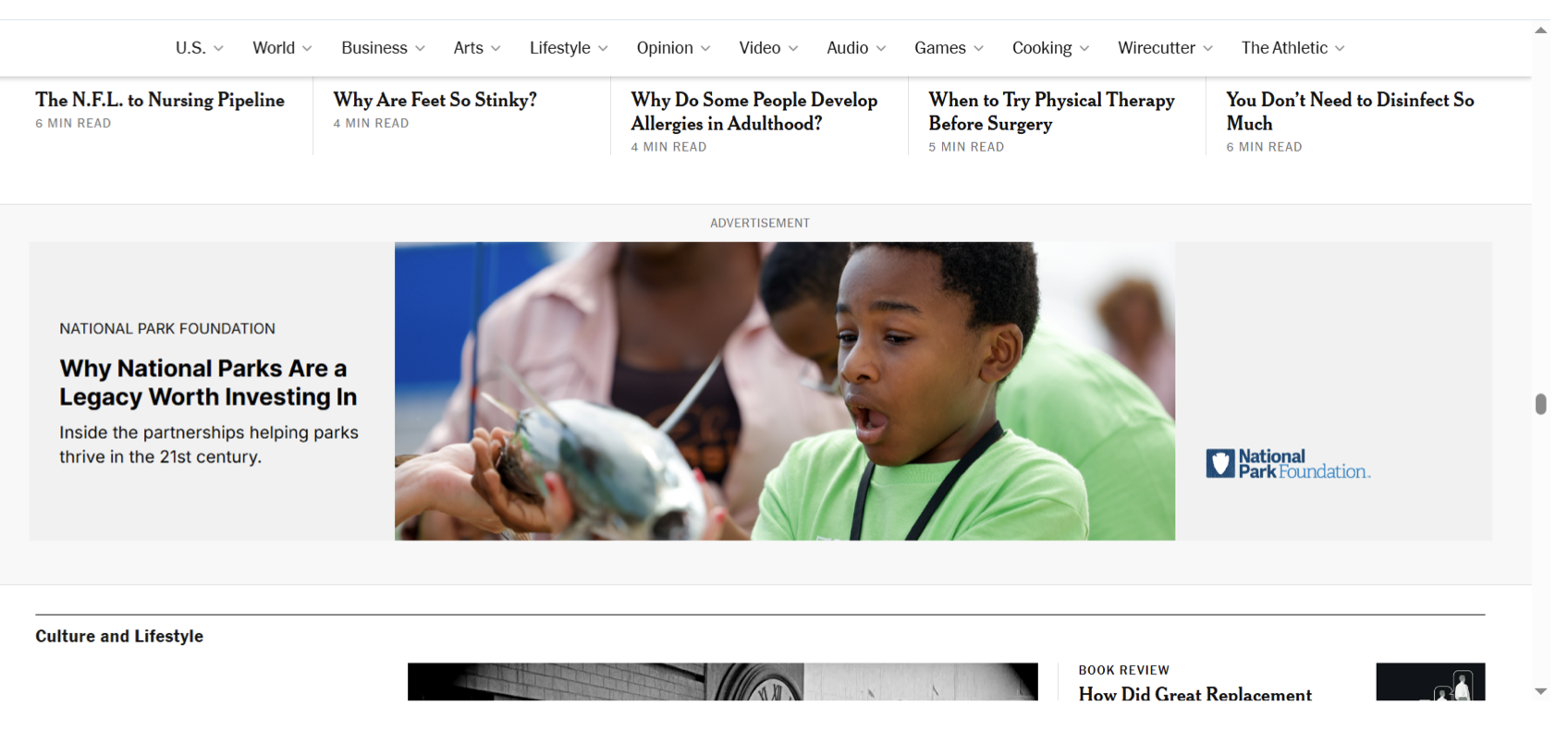 A webpage with articles and an advertisement. The main article is about why national parks are worth investing in, featuring a group of children exploring outdoors, with a child in a green shirt in focus. The webpage menu includes sections like U.S., World, Business, Arts, Lifestyle, Opinion, Video, Audio, Games, Cooking, Wirecutter, and The Athletic.