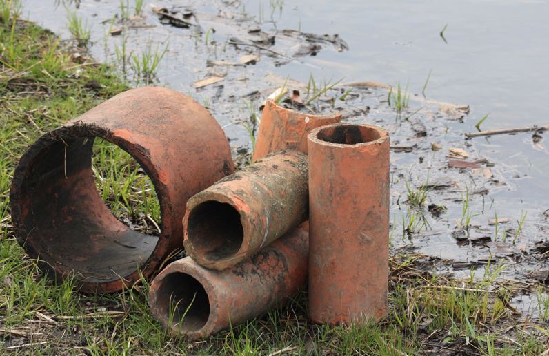 Different sizes of clay drain tiles removed from a TWI restoration site at Midewin National Tallgrass Prairie.