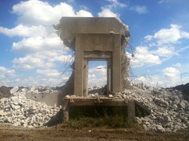 The National Forest Foundation is demolishing old concrete Army ammunition bunkers on the South Prairie Creek Outwash Plain at Midewin, clearing the way for TWI habitat restoration. Photo by Trevor Edmonson/TWI.
