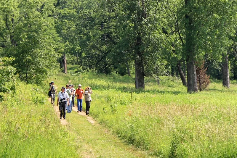 A survey group returns from a hike down the Dixon Refuge’s wooded seep trail to the Dore Seep Nature Preserve. Photo by Beth Botts.