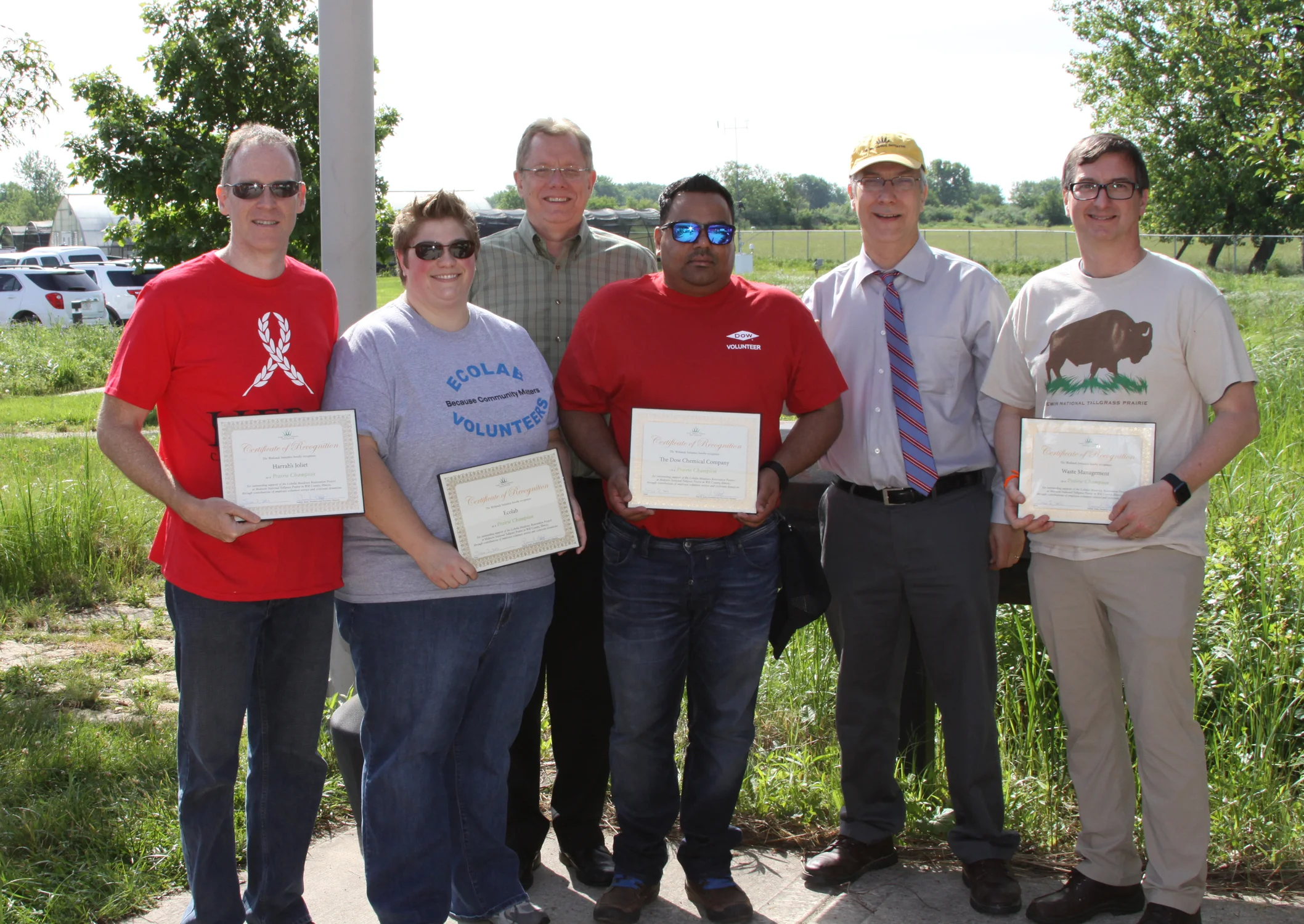 Representatives from the four participating companies (Ecolab, The Dow Chemical Company, Harrah’s Joliet, Waste Management) with Midewin Prairie Supervisor Wade Spang and TWI Executive Director Paul Botts.