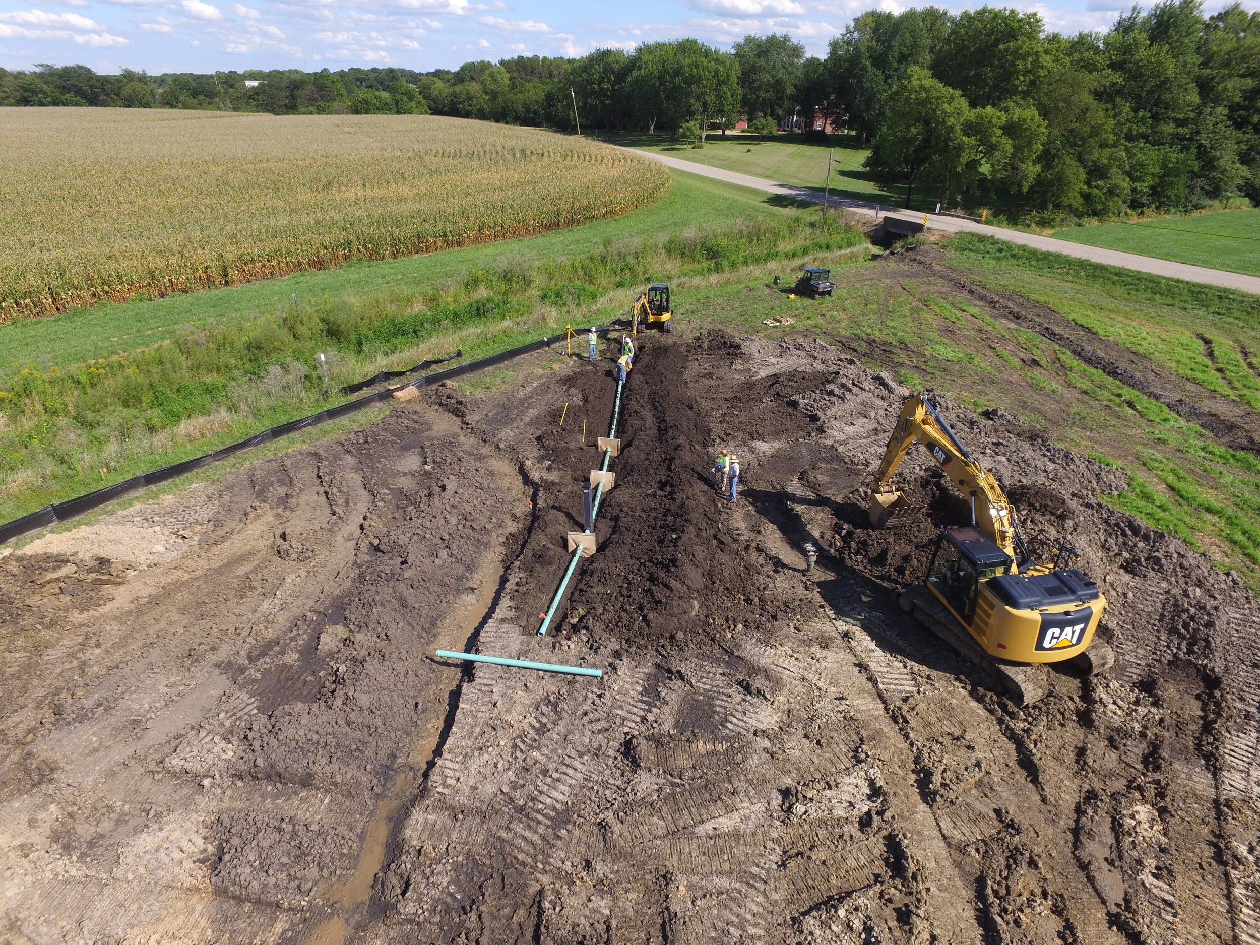 ILICA contractors at Bonucci Farms install the outlet pipe and water-control structure that will maintain water levels in the constructed wetland.