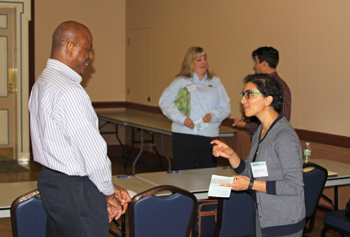 TWI project partner Mahsa Izadmehr (right) talks with a session attendee at the Illinois Water Conference on October 27 after her presentation on water quality monitoring of TWI’s first farm-based wetland.