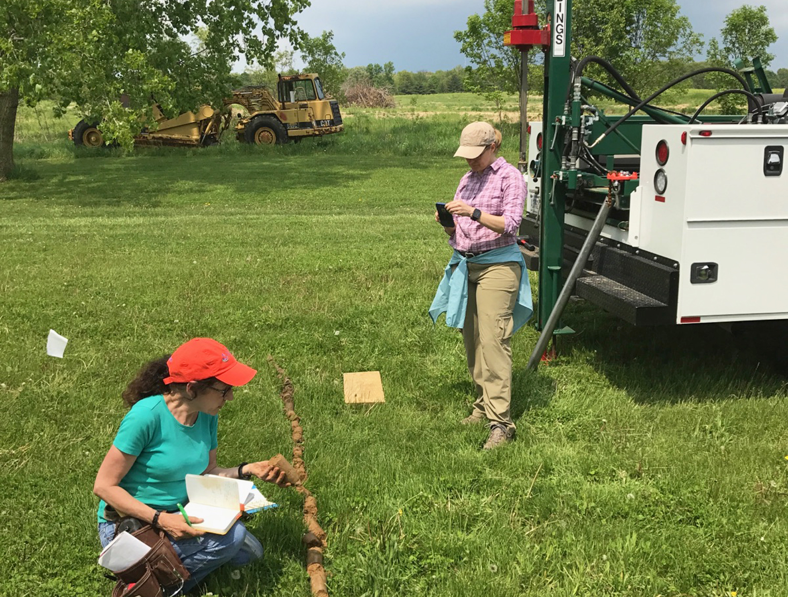 Dr. Jill Kostel (right), TWI’s senior environmental engineer, helps NRCS Geologist Diane Lamb take soil borings at the future site of the constructed wetland at Illinois Central College. Photo by Pete Fandel/ICC.