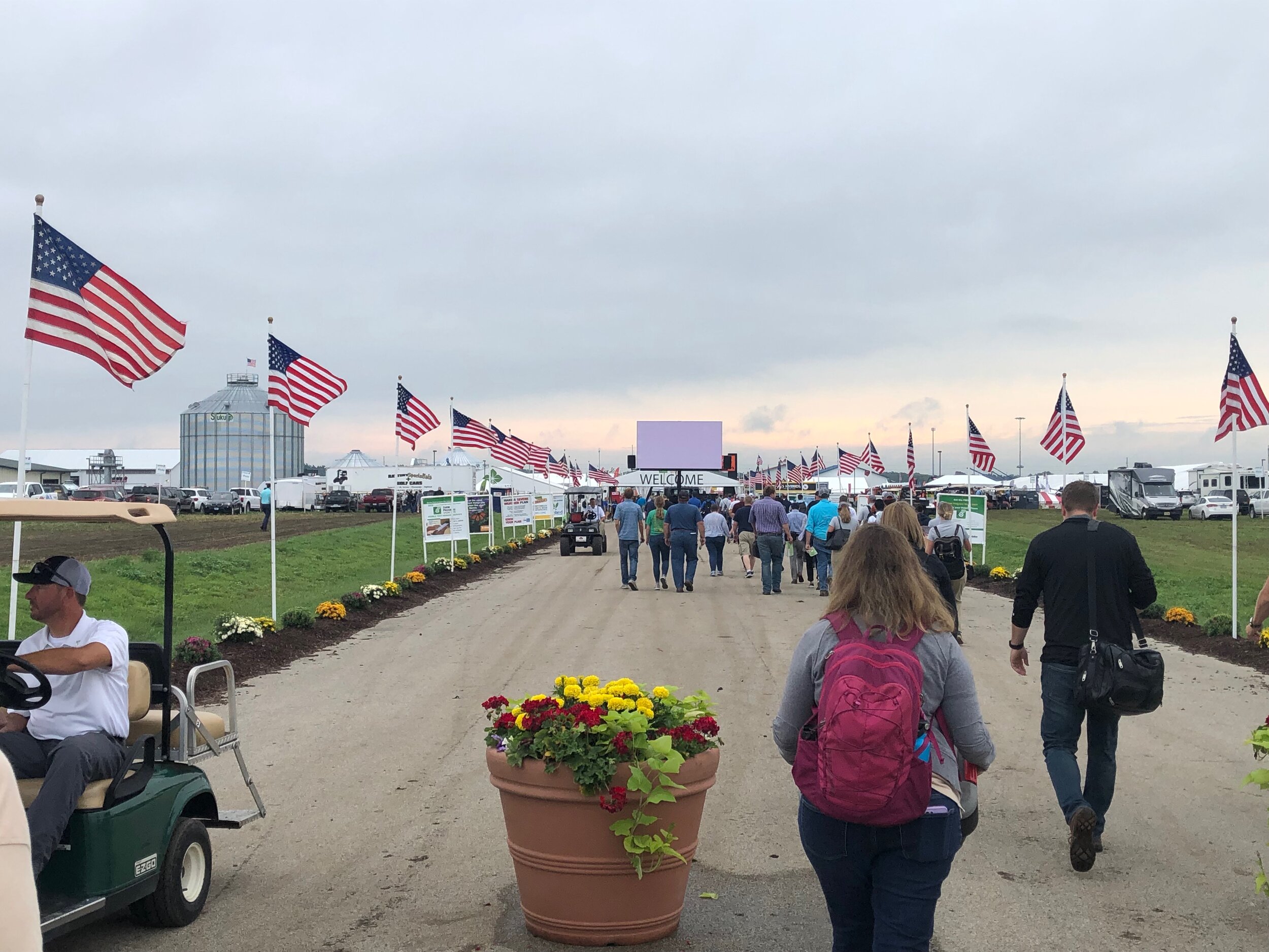 Jill Kostel, TWI’s senior environmental engineer, approaches the main entrance gate to the huge Farm Progress Show in Decatur, Illinois. Photo by John Briel/TWI.