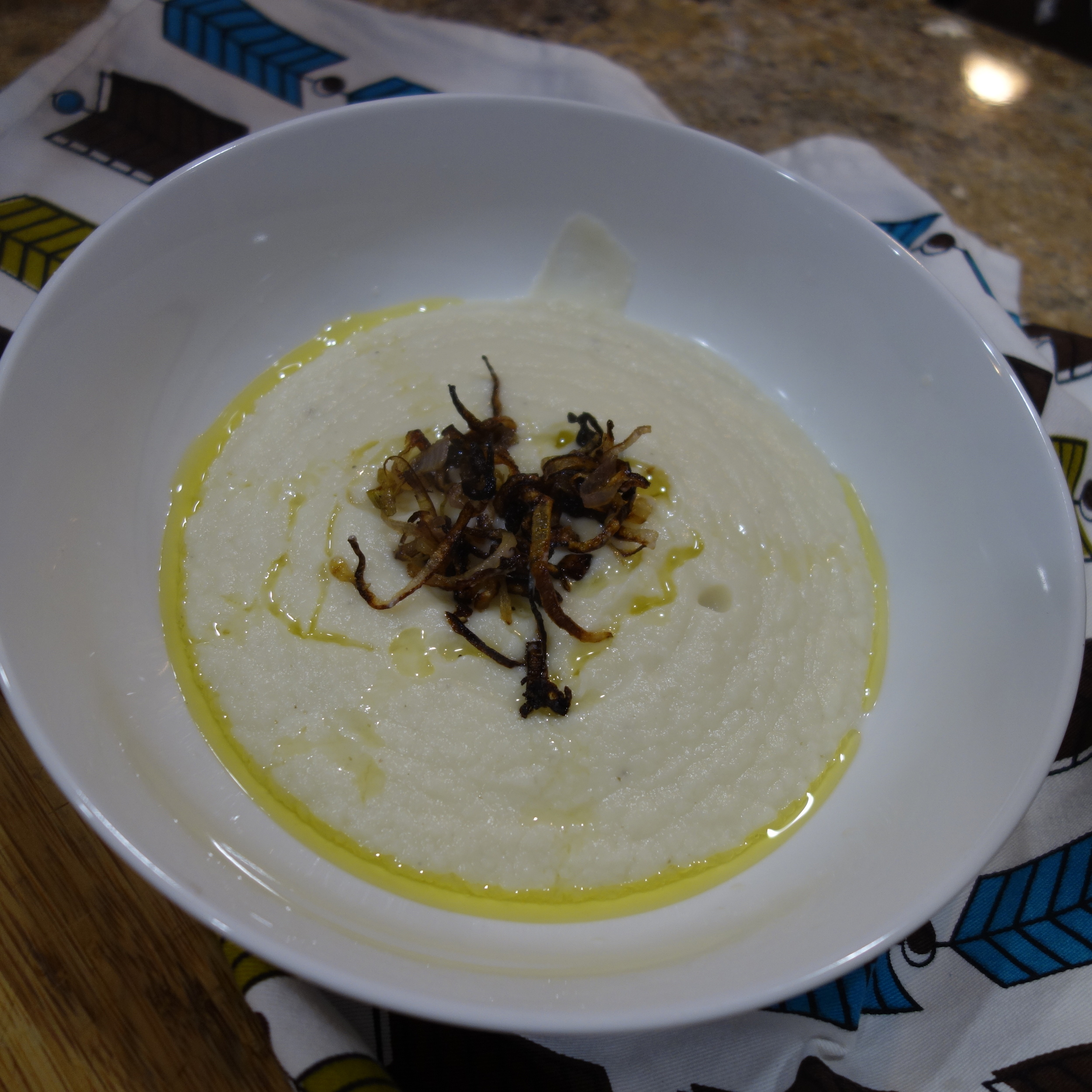 With crispy shallots and a drizzle of olive oil