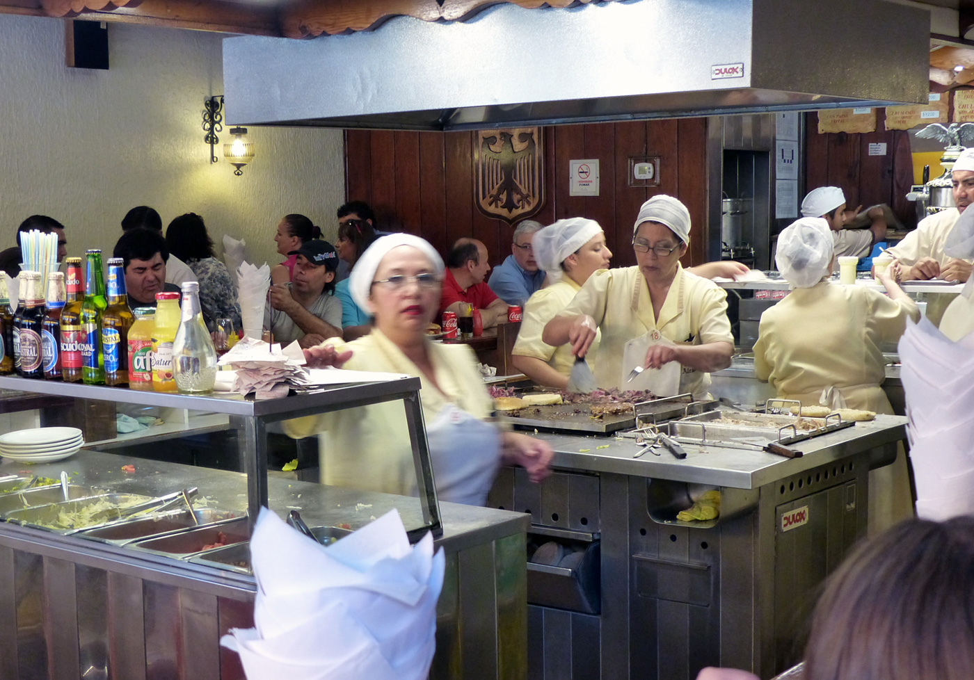 The busy action of these steadfast mavens of the pork sandwich.