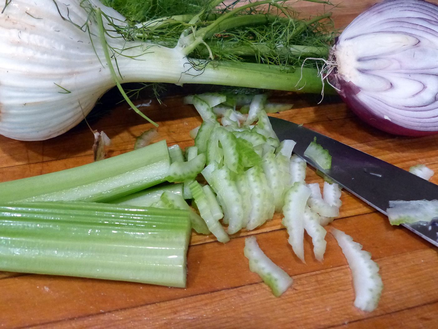 Slices of celery, thin enough to mingle but thick enough to provide crunch.