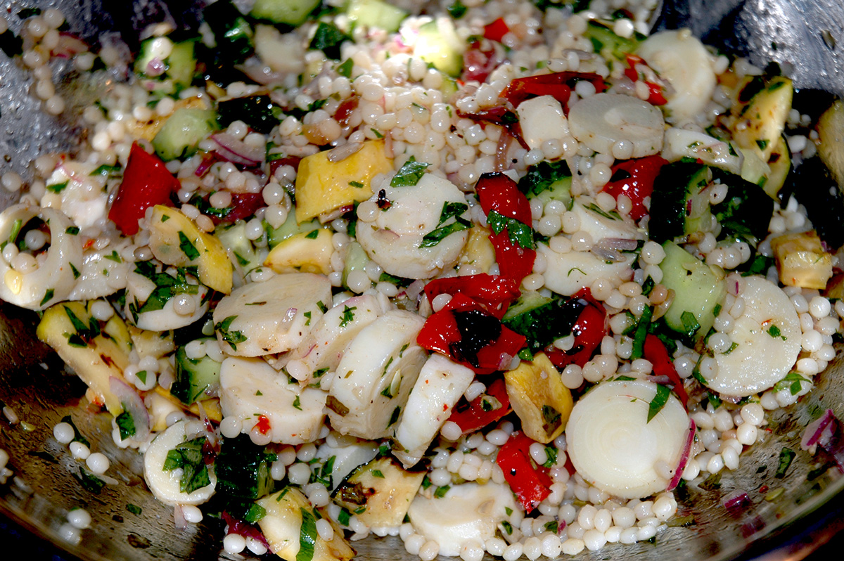 Israeli Couscous with grilled zucchini, summer squash, roasted red pepper, hearts of palm and a basil dressing.