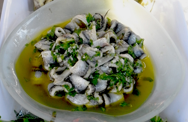 Garnished with crushed garlic, chopped parsley and fruity olive oil