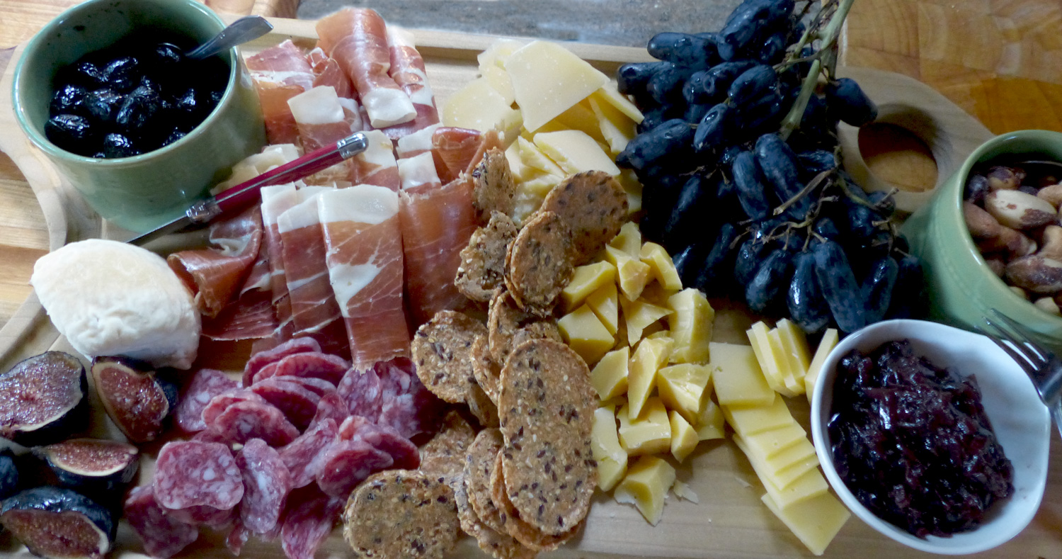 Abundancia: Figs, triple cream goat cheese, Moroccan oil cured olives, Serrano ham, Fuet, cheeses, grapes, nuts, onion jam (recipe coming soon) Mary's Gone Gluten Free crackers.