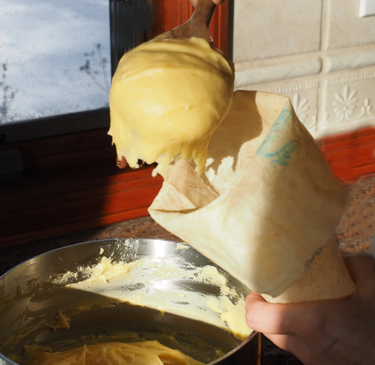 Spoon into piping bag. You can also use a large plastic bag and cut the corner off.
