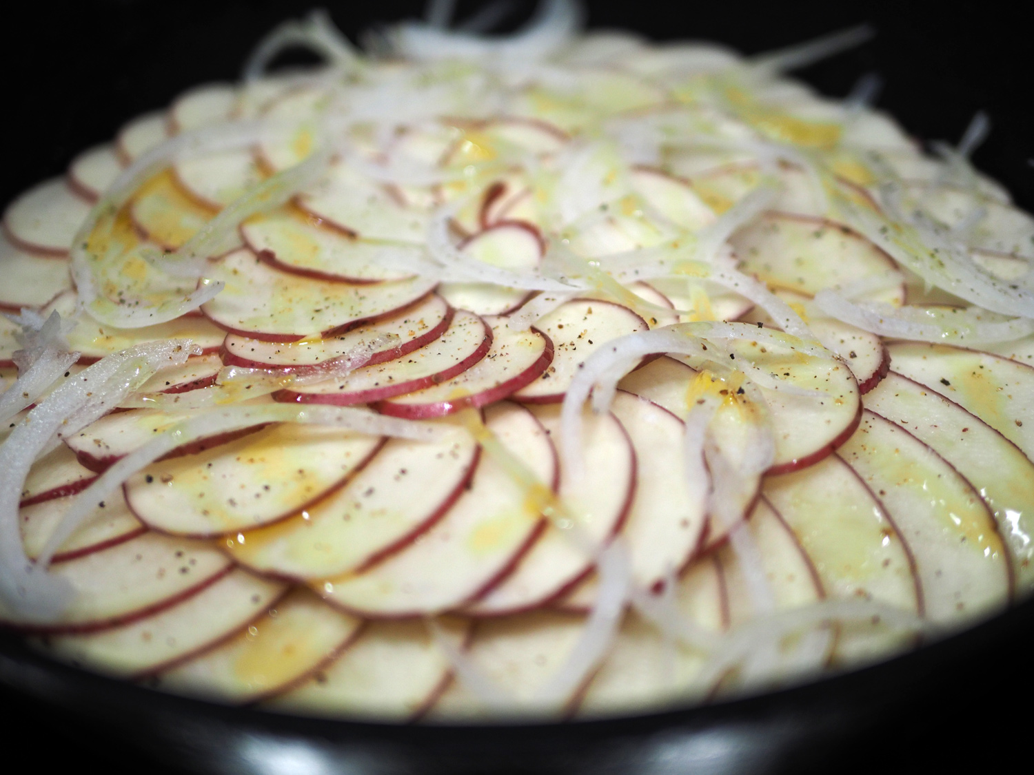 Continue layering adding onions, salt, pepper and oil to each layer.