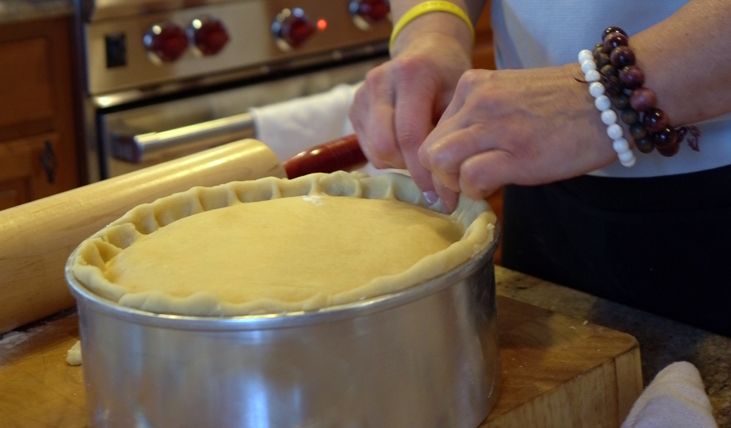 Using two index fingers, pinch the dough together to create a seal AND a pretty border.