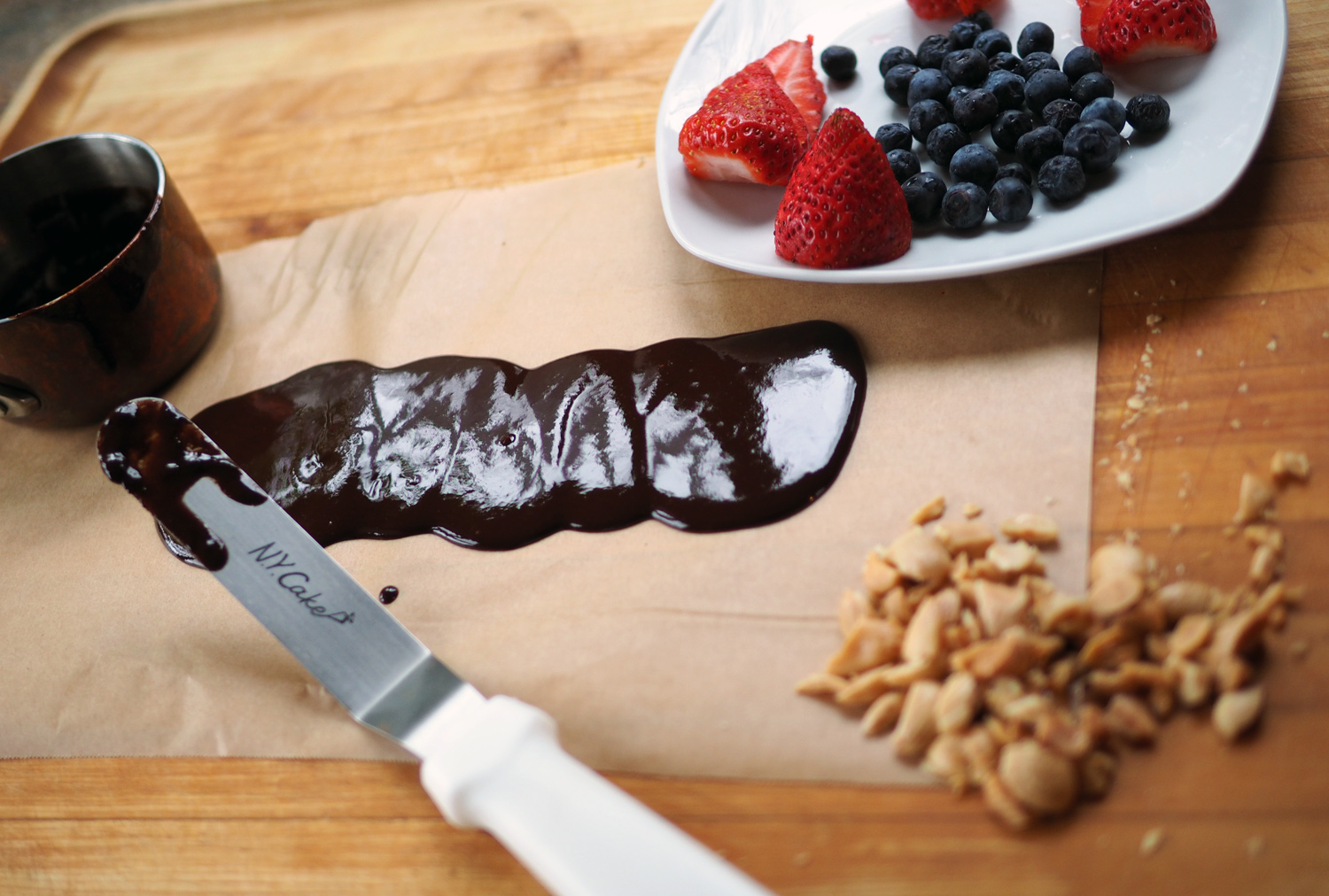 Spread the chocolate onto parchment paper.