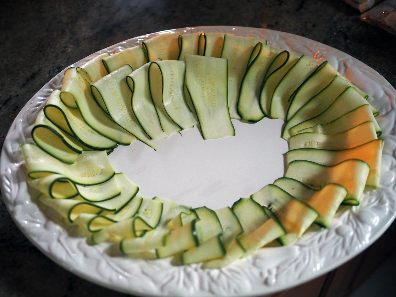 This was the plate I prepared for a recent family gathering. I just love how the zucchini falls over bowing with grace creating a spiral of garden goodness.