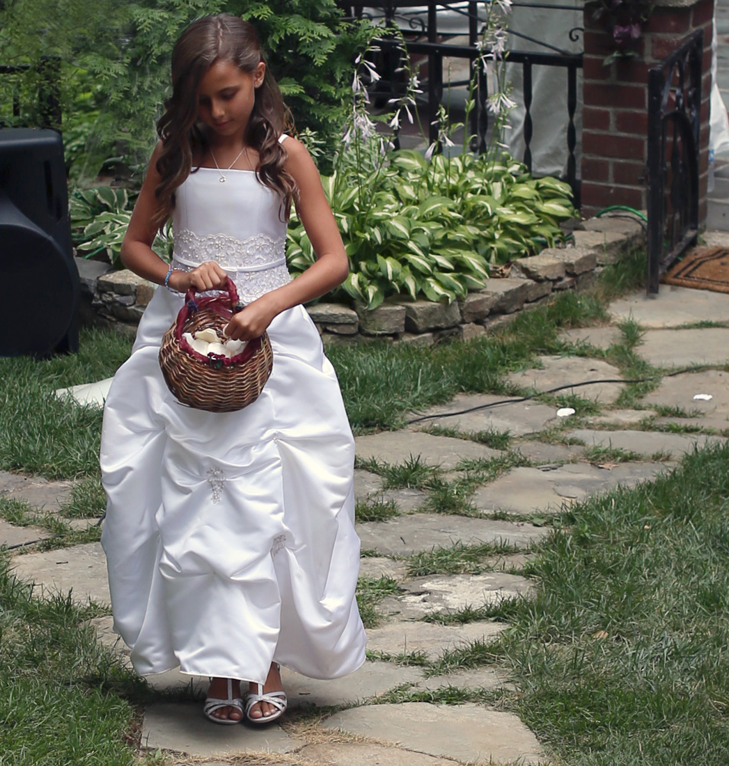 Nicolette Grace performing her flower girl duties with grace . (That wicker basket was used by Gianna & Michella when they were flower girls in my wedding. Truly, what loves around comes around. Yes, I kept them for 11 years. You never know when you may need something. Hehe)