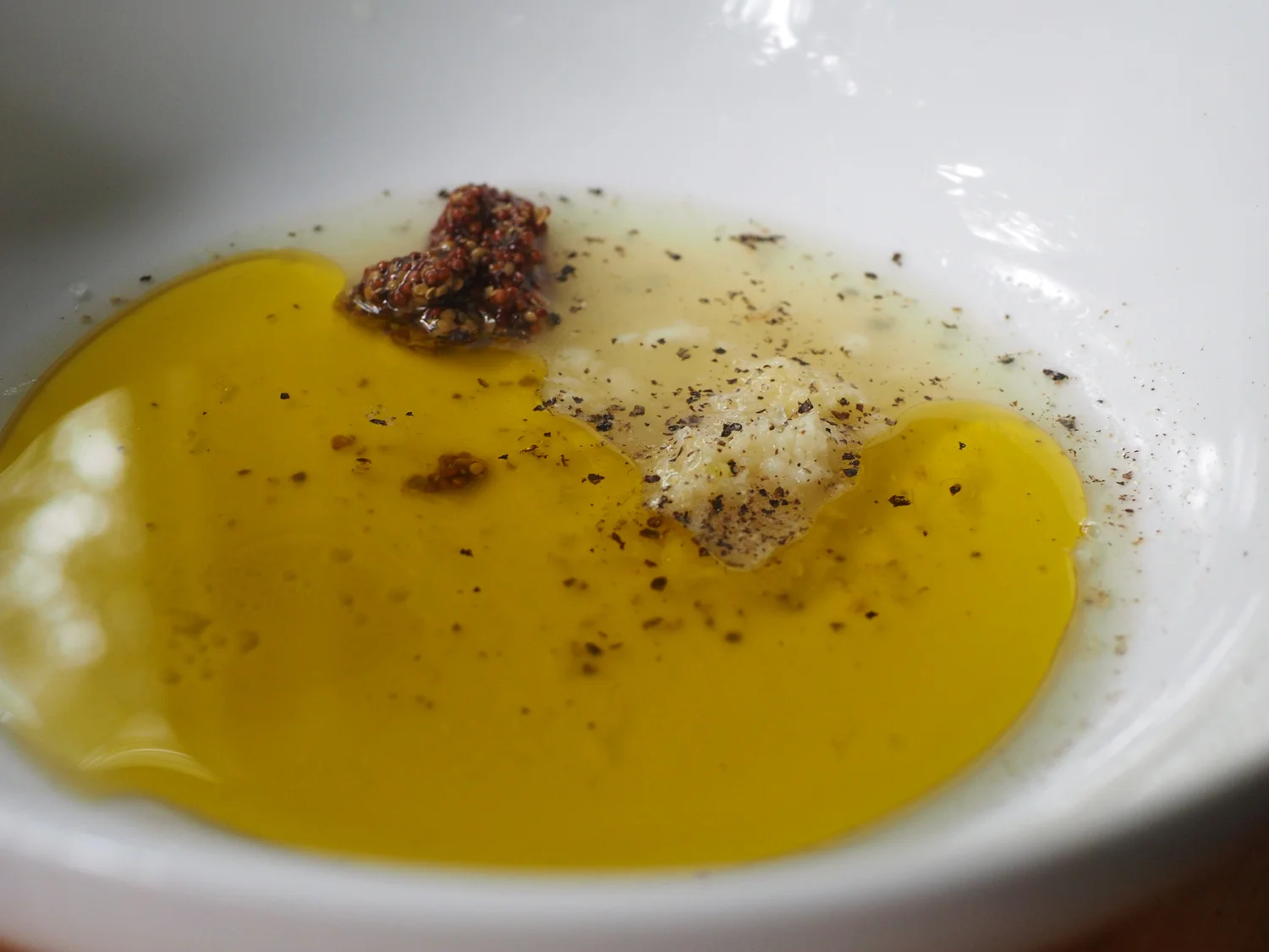 This dressing has a nice kick provided by the dijon grain mustard, the fresh grated ginger and garlic.