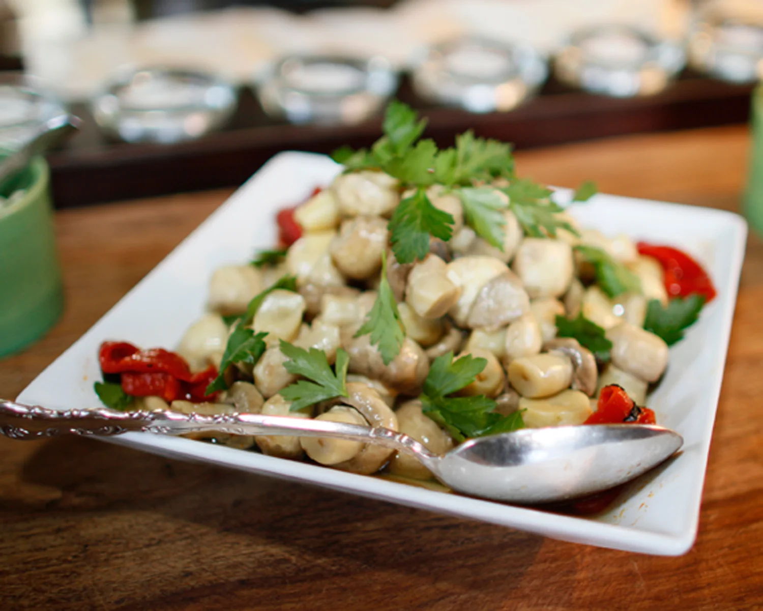 Marinated mushrooms, store bought and then enhanced with fresh parsley and roasted peppers
