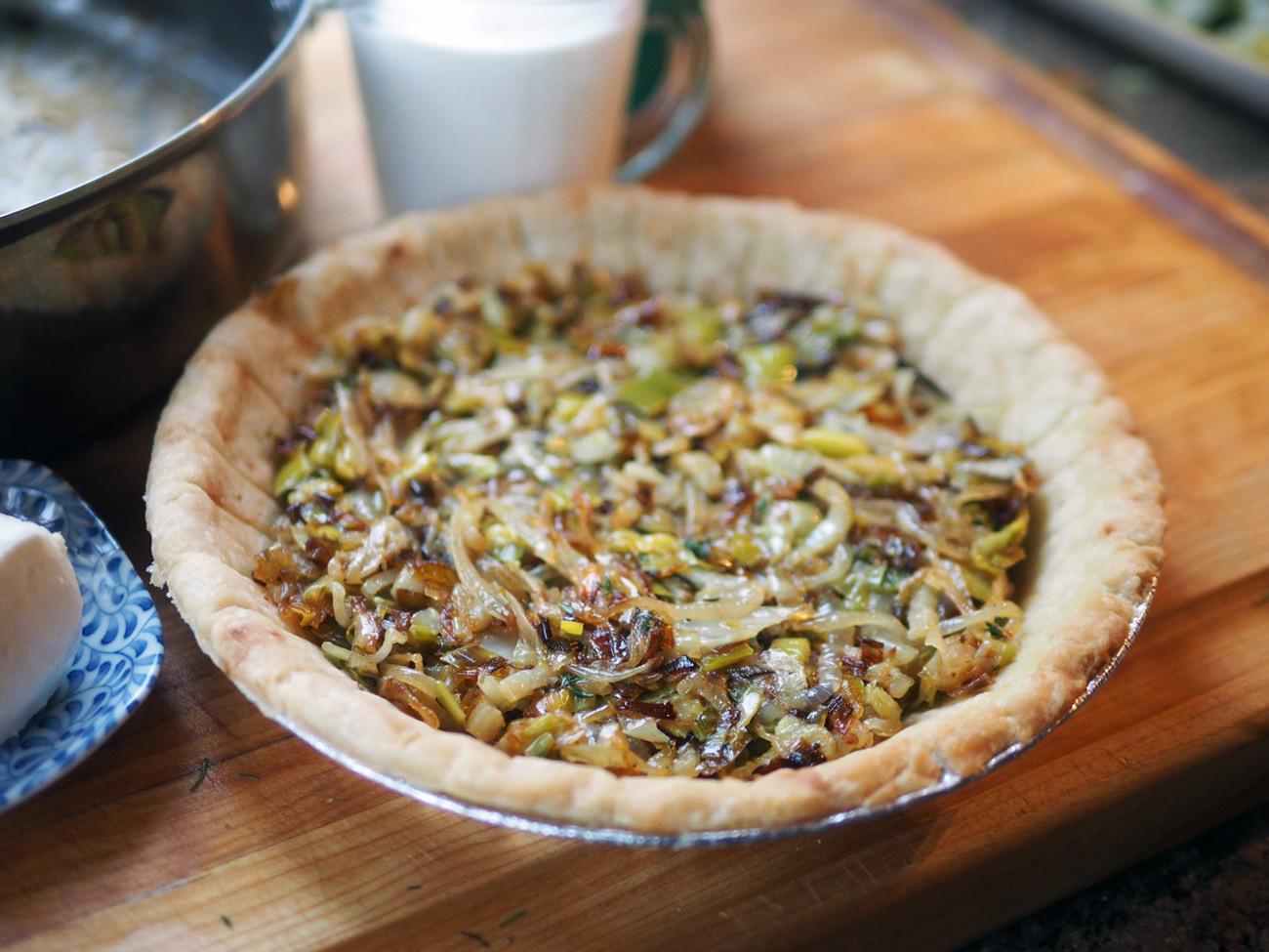 Fill the bottom with the sautéd vegetable mixture. (Or you can mix the veggies with the cream and goat cheese and then pour in.)
