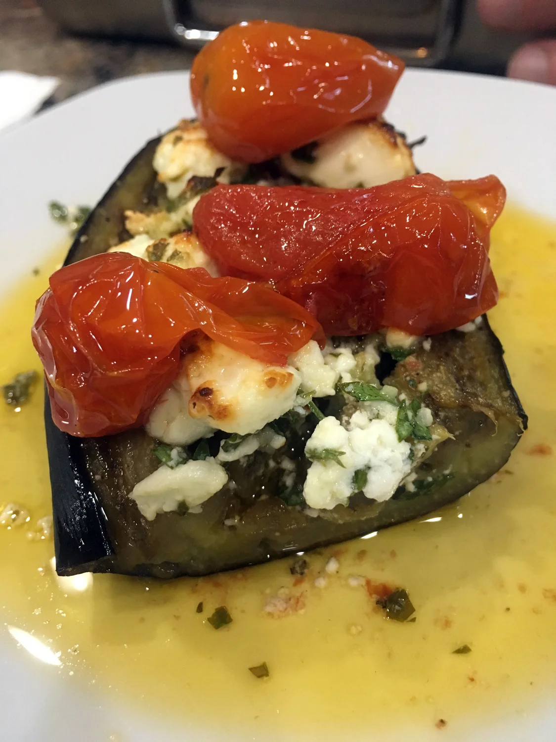 Roasted eggplant with feta gremolata and roasted tomatoes . Honestly, having a ton of roasted tomatoes in your fridge or freezer is your best secret weapon. The dishes you can make are endless!